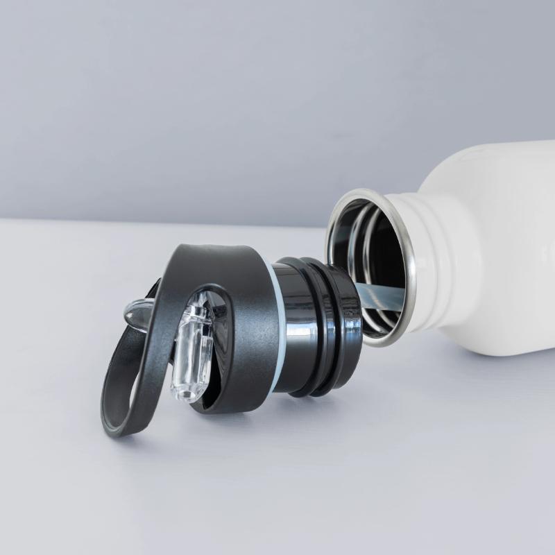 An apple with a variety of colorful paint splashes