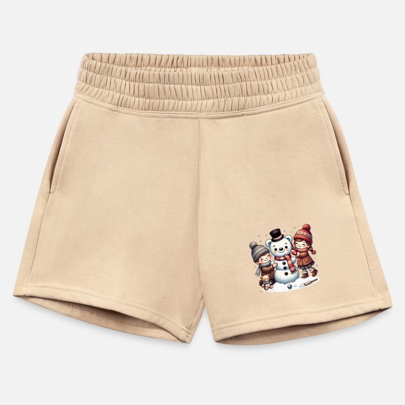 Winter fun: Children build a teddy snowman